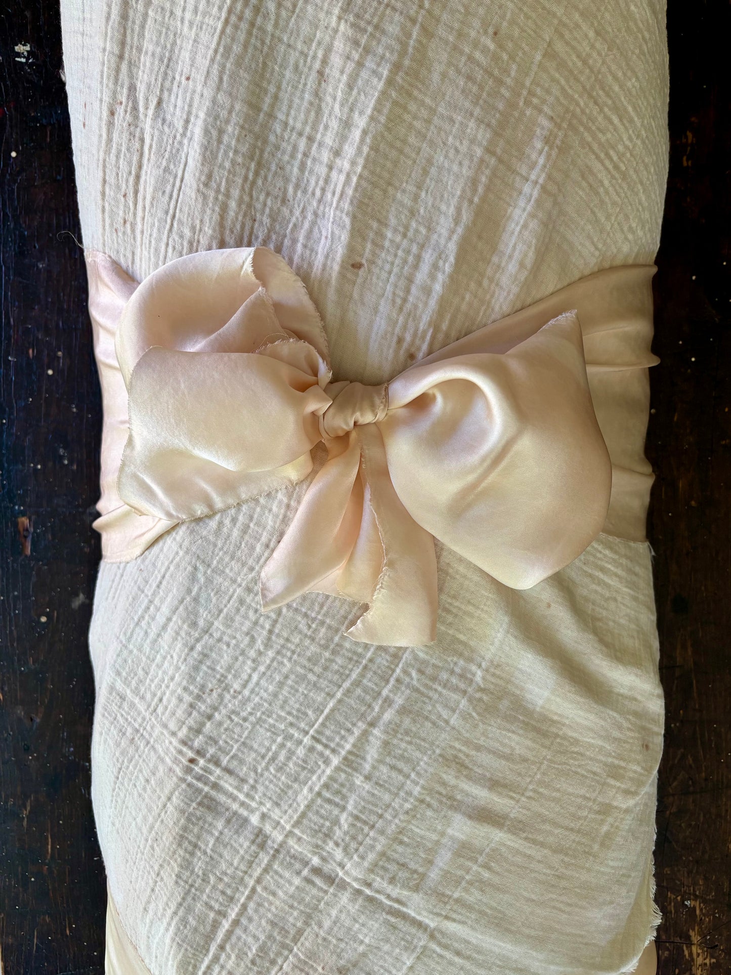Sanctum pink burial shroud with a large silk bow